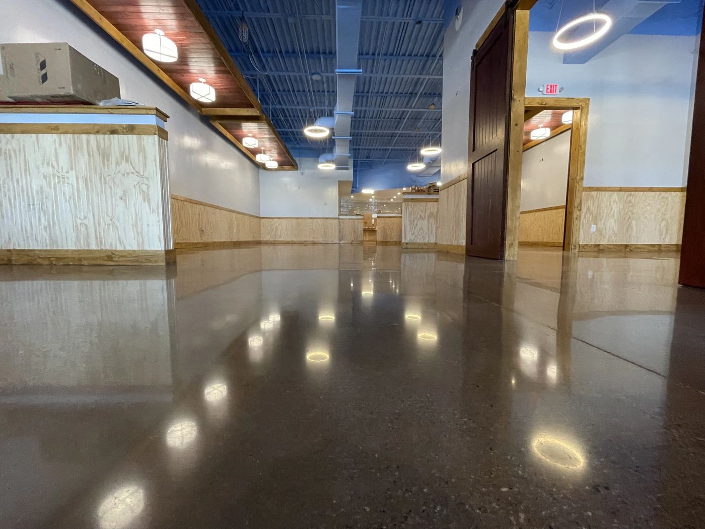 High-gloss polished concrete floor in a Waltham space