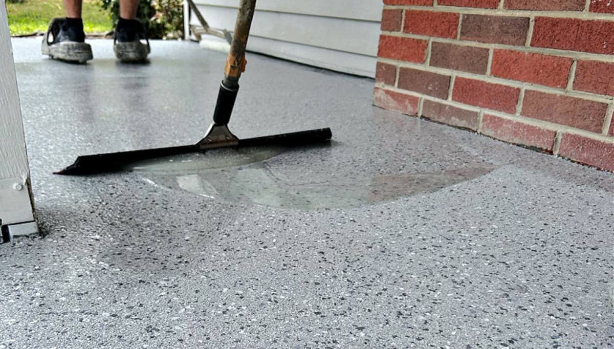 Applying a fresh epoxy coating to repair a failing floor in the Greater Boston area